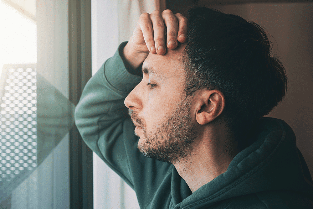 Man staring out the window