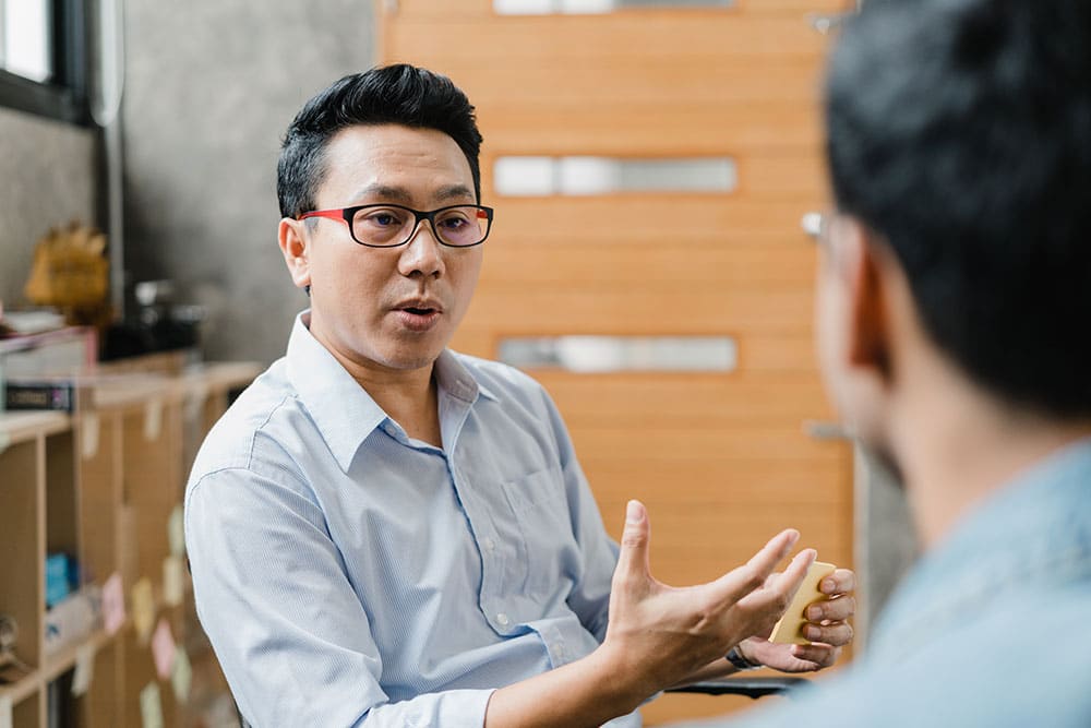Staff talking about financial wellbeing at work